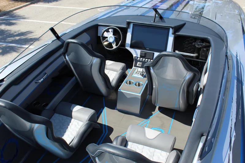  Yacht Photos Pics 2025 Fountain 34 Thundercat interior with modern seating and advanced dashboard.