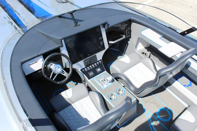  Yacht Photos Pics 2025 Fountain 34 Thundercat cockpit with modern steering and control panel.