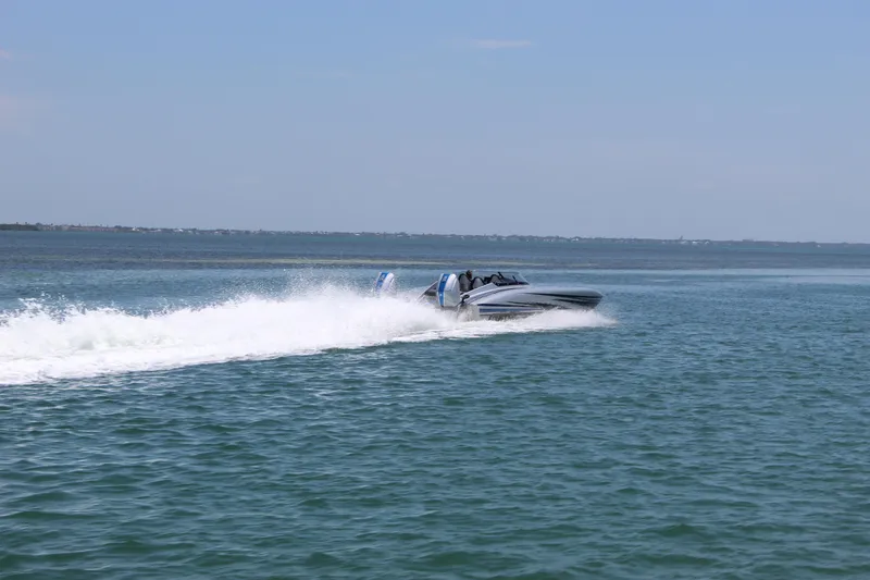  Yacht Photos Pics 2025 Fountain 34 Thundercat speedboat cruising on open water.