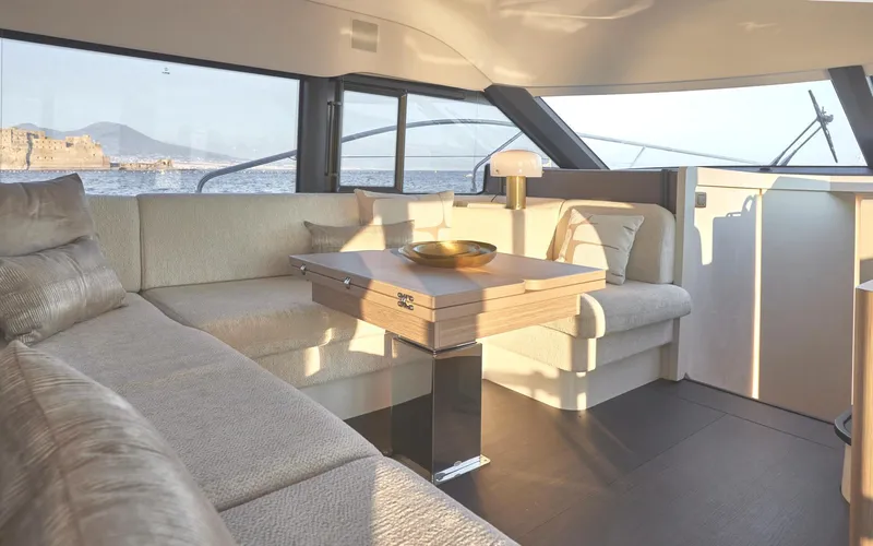  Yacht Photos Pics Luxurious interior of 2025 Prestige F 4.9 yacht with elegant seating and sea view.
