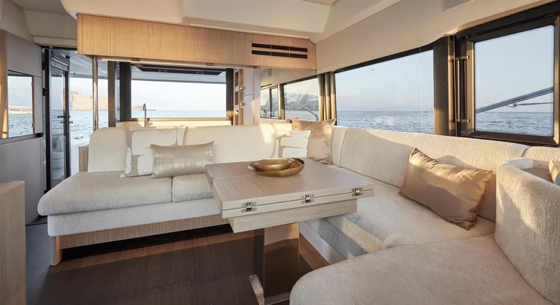  Yacht Photos Pics Luxurious interior of 2025 Prestige F 4.9 yacht with elegant seating and ocean view.
