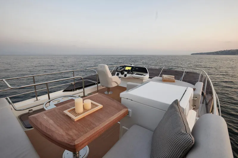  Yacht Photos Pics Luxurious Prestige F 4.9 yacht deck, 2025 model, with elegant seating and ocean view.
