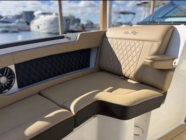  Yacht Photos Pics Luxurious seating on 2022 Sea Ray SLX 280 boat, featuring elegant tan upholstery.
