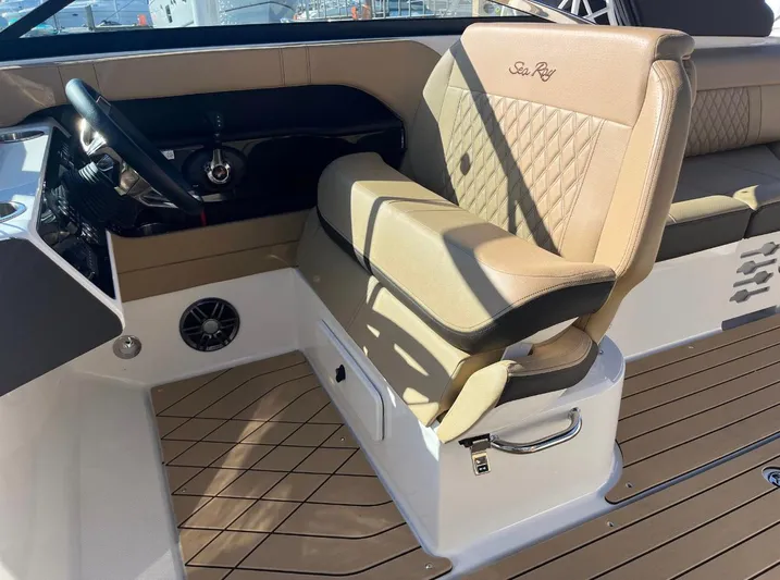  Yacht Photos Pics 2022 Sea Ray SLX 280 boat interior with tan leather seating and modern dashboard.