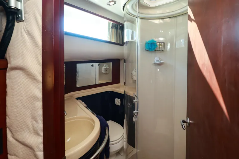 Aphrodite Yacht Photos Pics Luxurious bathroom in 2004 Chris-Craft Roamer 40 yacht with shower and vanity.