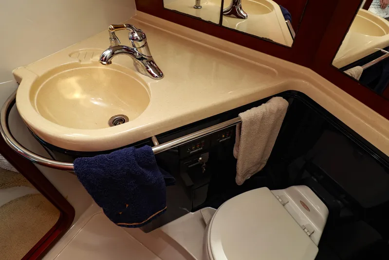 Aphrodite Yacht Photos Pics Luxurious bathroom in 2004 Chris-Craft Roamer 40 yacht with sink and toilet.