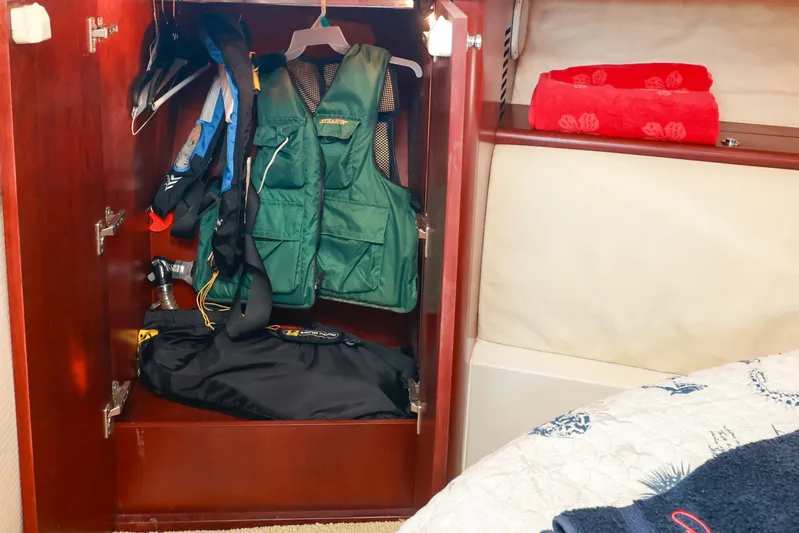 Aphrodite Yacht Photos Pics Closet in 2004 Chris-Craft Roamer 40 with life jackets and red towels.
