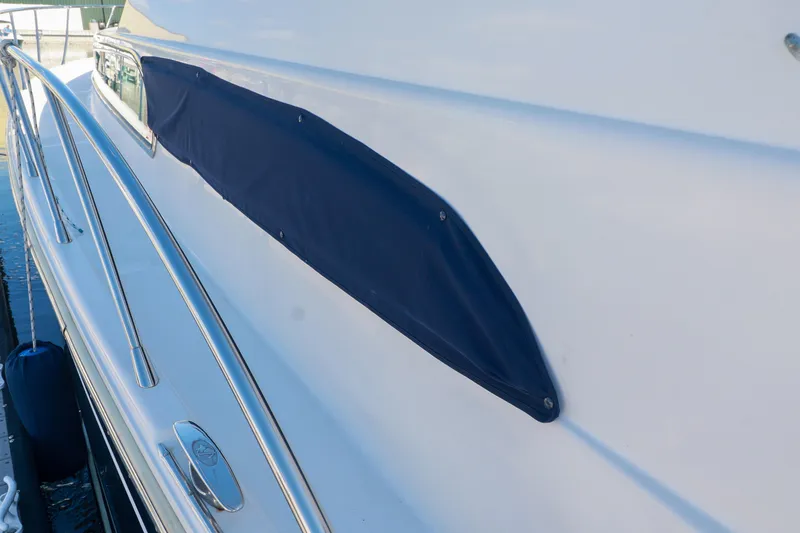 Aphrodite Yacht Photos Pics 2004 Chris-Craft Roamer 40 yacht with sleek design and blue cover detail.