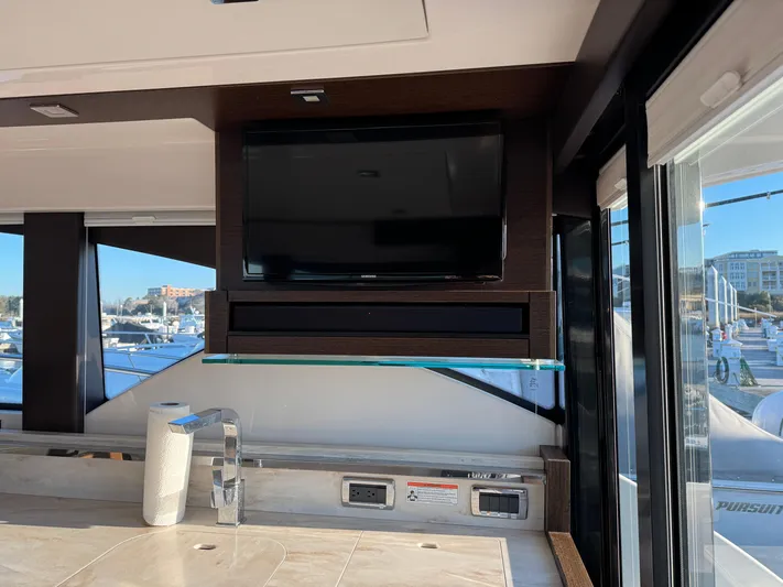 After Glow Yacht Photos Pics Interior of 2016 Tiara Yachts 39 Coupe with TV and modern kitchen amenities.