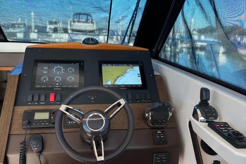 After Glow Yacht Photos Pics 2016 Tiara Yachts 39 Coupe helm with navigation screens and controls.