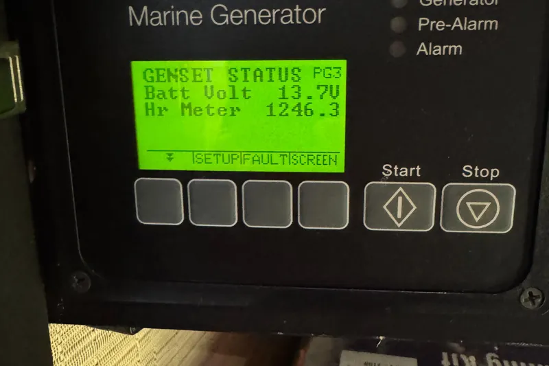 After Glow Yacht Photos Pics Marine generator display showing battery voltage and hour meter for 2016 Tiara Yachts 39 Coupe.