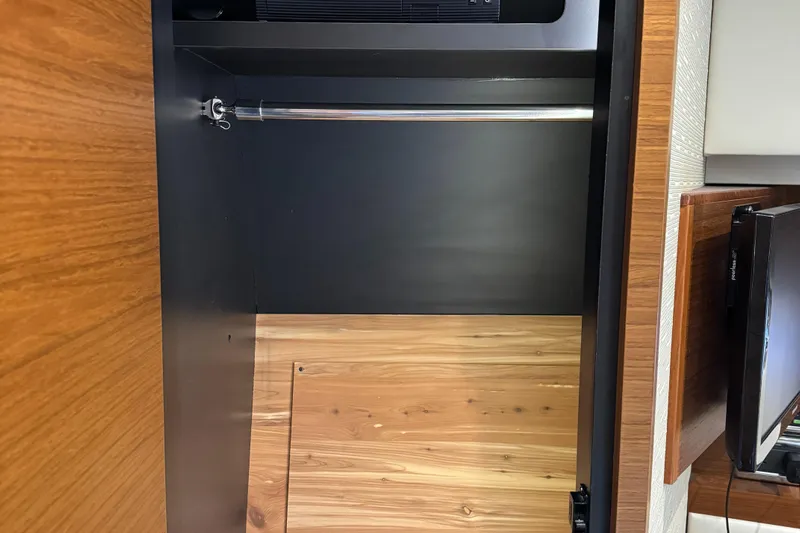 After Glow Yacht Photos Pics Interior closet of 2016 Tiara Yachts 39 Coupe with wooden finish.