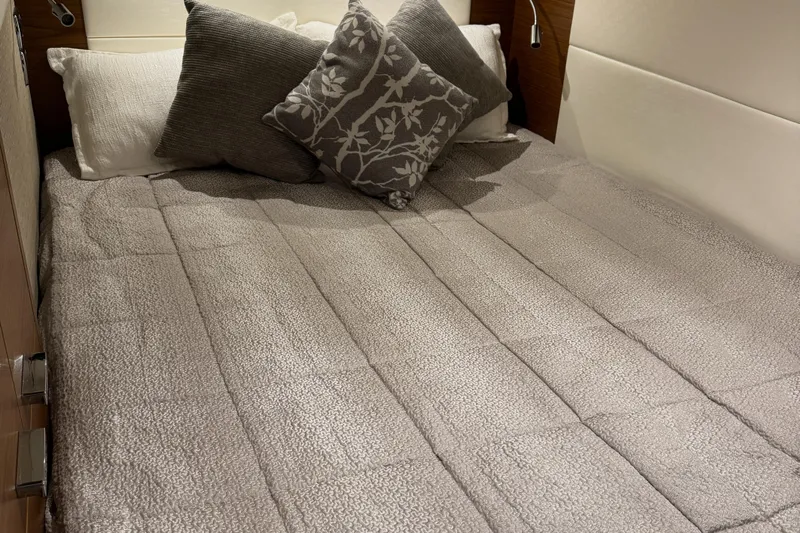 After Glow Yacht Photos Pics Luxurious bed in 2016 Tiara Yachts 39 Coupe cabin with elegant gray bedding.