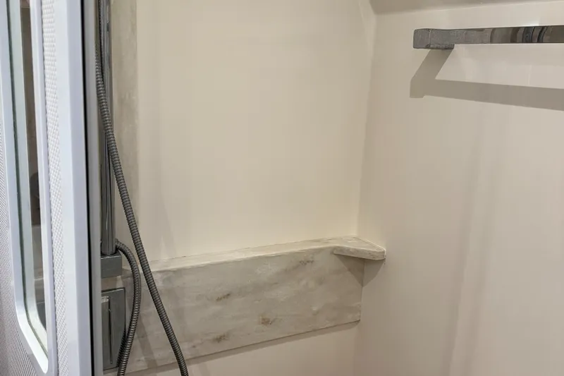 After Glow Yacht Photos Pics Shower area in 2016 Tiara Yachts 39 Coupe, featuring modern fixtures and sleek design.