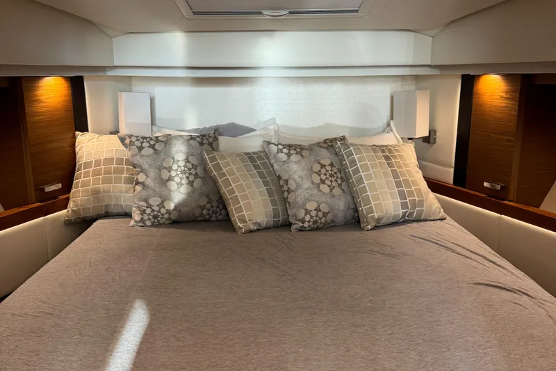 After Glow Yacht Photos Pics Luxurious bedroom interior of 2016 Tiara Yachts 39 Coupe with elegant bedding.