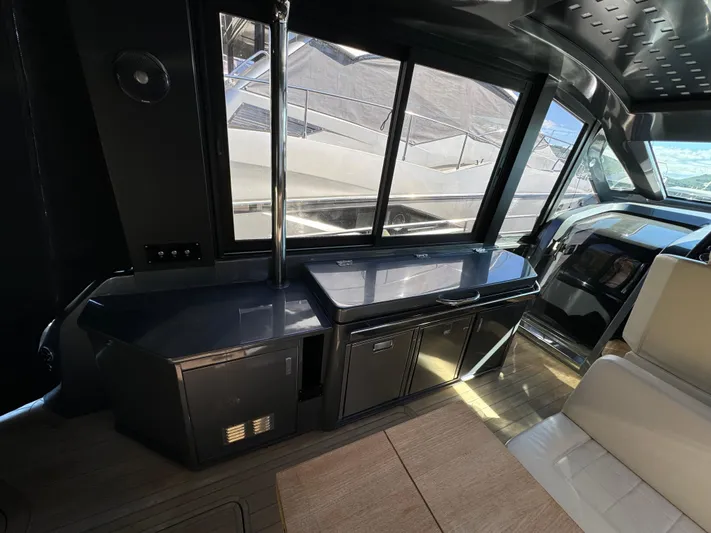 Anahita Yacht Photos Pics Interior of 2017 SACS Rebel 47 yacht with sleek cabinetry and large windows.