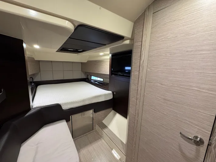 Anahita Yacht Photos Pics Interior cabin of 2017 SACS Rebel 47 yacht, featuring a bed and modern design.