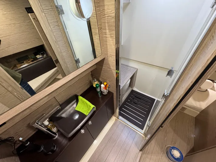 Anahita Yacht Photos Pics Bathroom interior of 2017 SACS Rebel 47 yacht, featuring modern sink and sleek design.