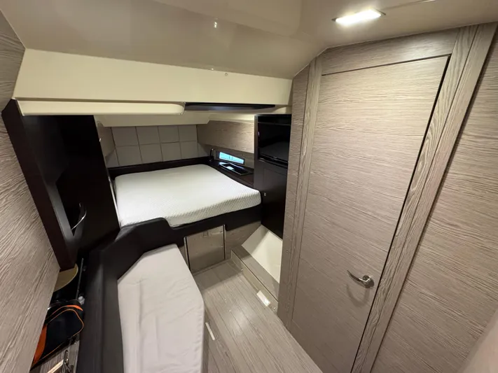 Anahita Yacht Photos Pics Interior cabin of 2017 SACS Rebel 47 yacht with modern design and cozy bed.