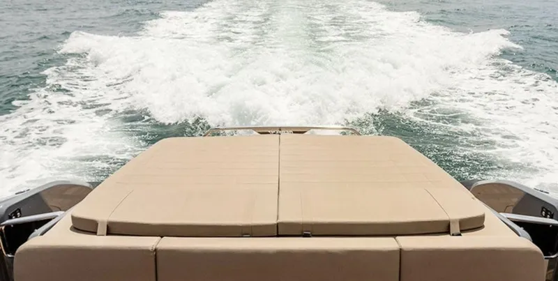 Anahita Yacht Photos Pics SACS Rebel 47 (2017) cruising, view from rear deck with wake in the water.