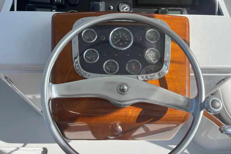 Charmer Yacht Photos Pics 1985 Rybovich Walkaround boat steering wheel and dashboard.