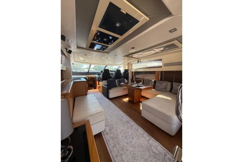 Jimbo Yacht Photos Pics Luxurious interior of 2012 Sunseeker Predator Sport Yacht 74 with elegant seating and modern design.