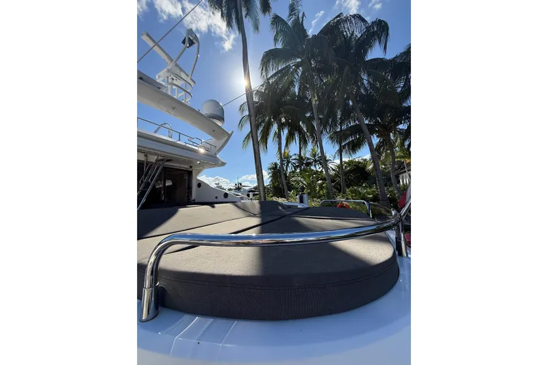 Jimbo Yacht Photos Pics Sunseeker Predator Sport Yacht 74, 2012, with palm trees and clear sky background.