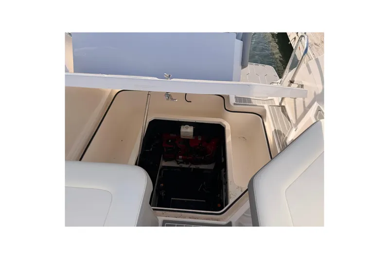  Yacht Photos Pics Open engine compartment of 2022 Regal 26 XO boat, showing interior details.