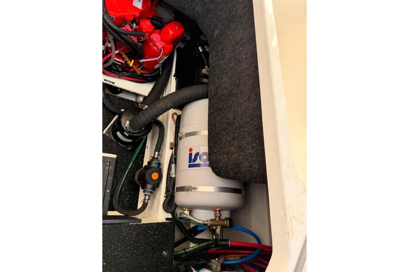  Yacht Photos Pics Engine compartment of a 2022 Regal 26 XO boat, featuring mechanical components and wiring.