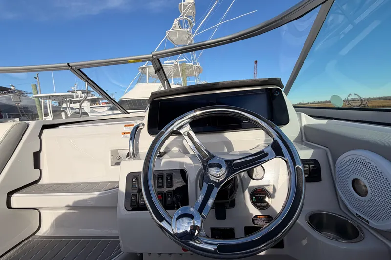  Yacht Photos Pics 2022 Regal 26 XO boat helm with steering wheel and control panel.