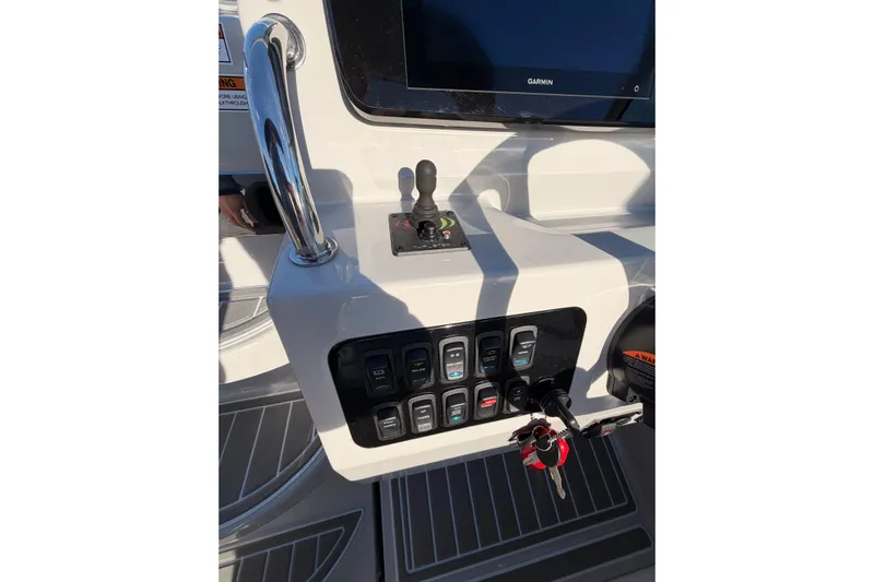 Yacht Photos Pics Control panel of 2022 Regal 26 XO boat with switches and Garmin display.