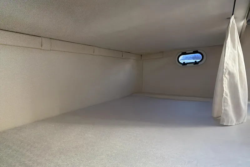  Yacht Photos Pics Interior cabin of 2022 Regal 26 XO boat with window and curtain.