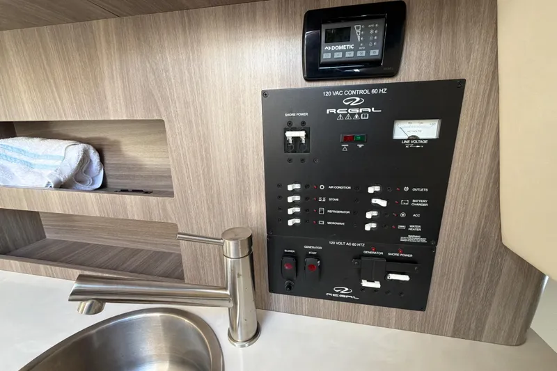  Yacht Photos Pics 2022 Regal 26 XO boat control panel with sink and storage shelf.