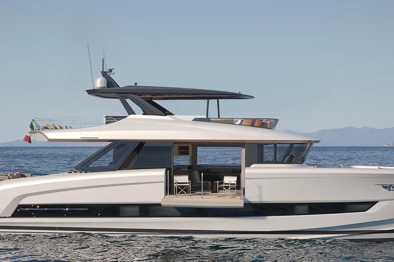  Yacht Photos Pics 2026 Solaris Power 70 Long Range yacht cruising on calm sea with clear sky.