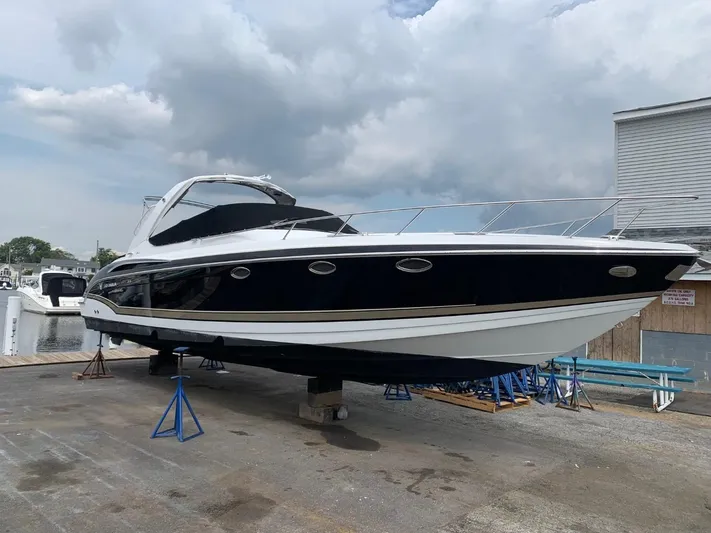 Last One III Yacht Photos Pics 2013 Formula 370 Super Sport boat on dry dock, black and white hull.