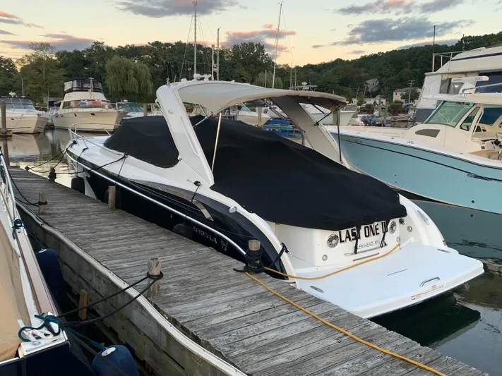 Last One III Yacht Photos Pics 2013 Formula 370 Super Sport boat docked at a marina.