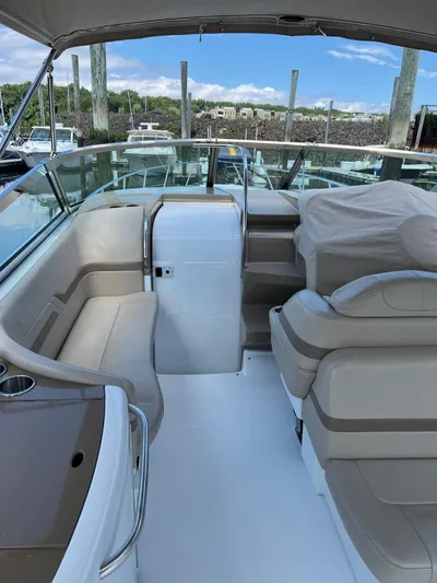 Last One III Yacht Photos Pics 2013 Formula 370 Super Sport boat interior with beige seating and docked in marina.