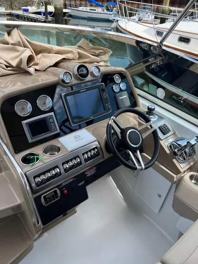 Last One III Yacht Photos Pics 2013 Formula 370 Super Sport boat dashboard with advanced navigation controls.