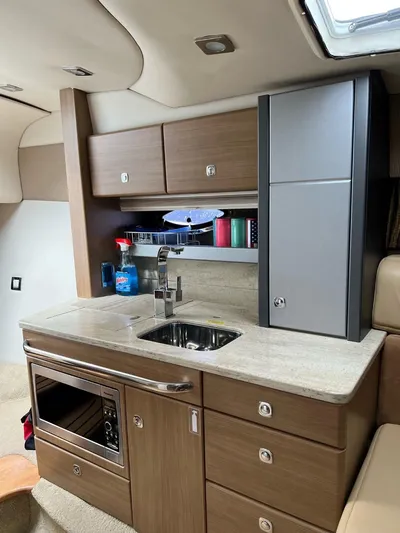 Last One III Yacht Photos Pics 2013 Formula 370 Super Sport yacht interior kitchen with modern appliances.