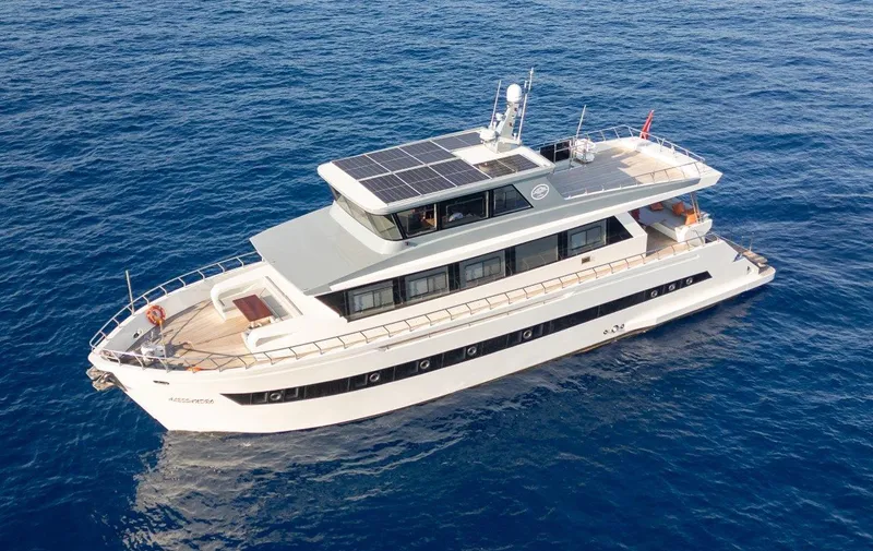  Yacht Photos Pics Modern 2024 Custom Trawler RPH yacht cruising on open blue sea.