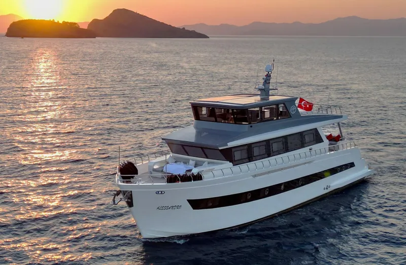  Yacht Photos Pics Modern Trawler RPH 2024 cruising at sunset, featuring sleek design and Turkish flag.