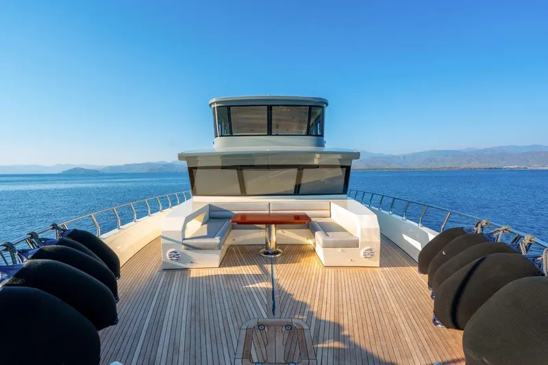  Yacht Photos Pics Modern Trawler RPH 2024 yacht with spacious deck and seating, cruising on open water.