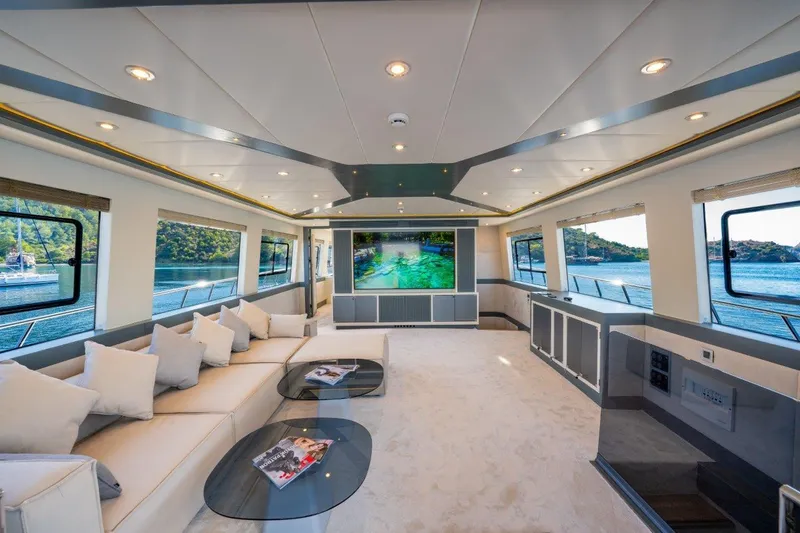  Yacht Photos Pics Luxurious interior of 2024 Custom Modern Trawler RPH with panoramic windows and elegant seating.
