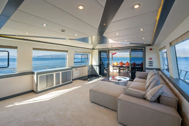  Yacht Photos Pics Luxurious interior of 2024 Custom Modern Trawler RPH with ocean view and plush seating.