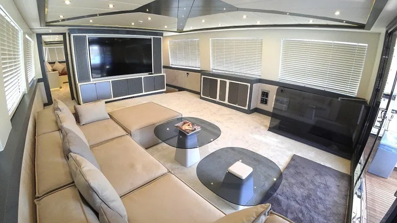  Yacht Photos Pics Luxurious interior of 2024 Custom Modern Trawler RPH with spacious seating and large TV.