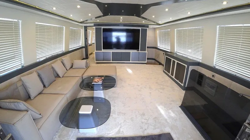  Yacht Photos Pics Luxurious interior of 2024 Custom Modern Trawler RPH with plush seating and large TV.