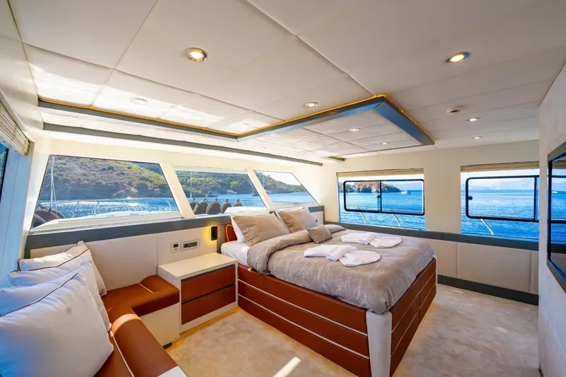  Yacht Photos Pics Luxurious 2024 Custom Modern Trawler RPH bedroom with ocean view and elegant interior design.