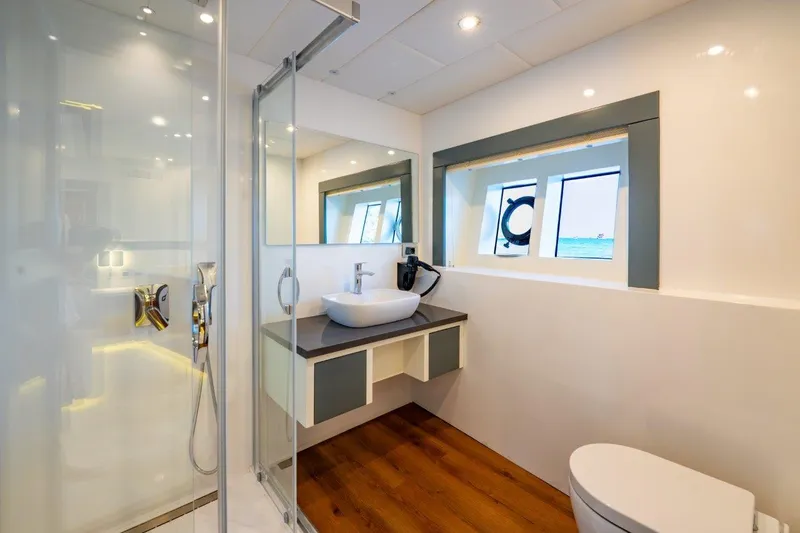  Yacht Photos Pics Modern bathroom on 2024 Custom Trawler RPH with shower, sink, and toilet.