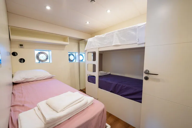  Yacht Photos Pics Modern Trawler RPH 2024 cabin with bunk beds and porthole windows.