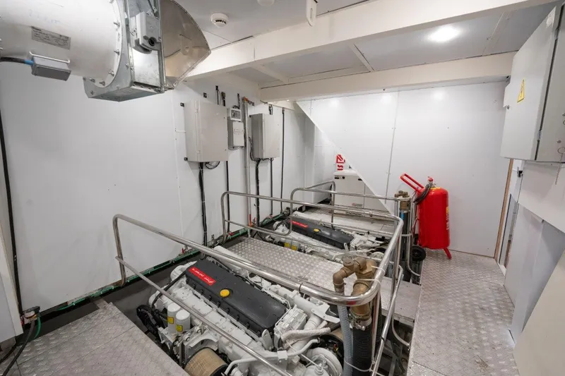  Yacht Photos Pics Engine room of 2024 Custom Modern Trawler RPH with dual engines and safety equipment.